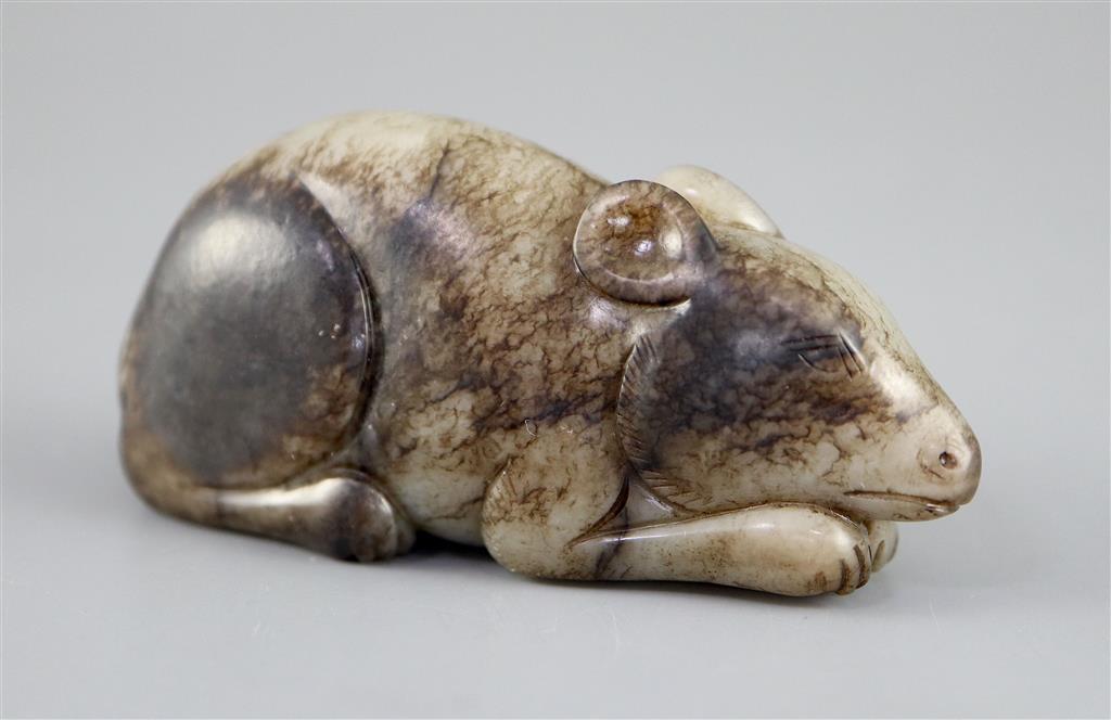 A Chinese grey and black jade figure of a recumbent mouse, 7.7cm long